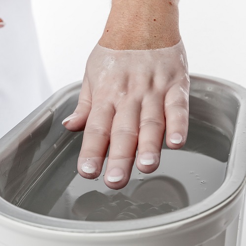 Parafinbad für die Hand als ergänzendes Heilmittel in der Ergotherapie